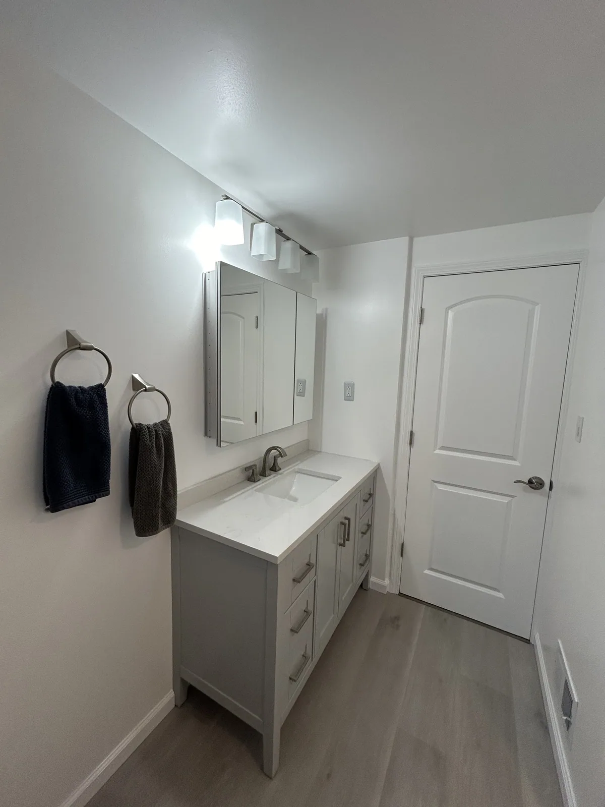 Modern bathroom remodel with a clean vanity and bright finish