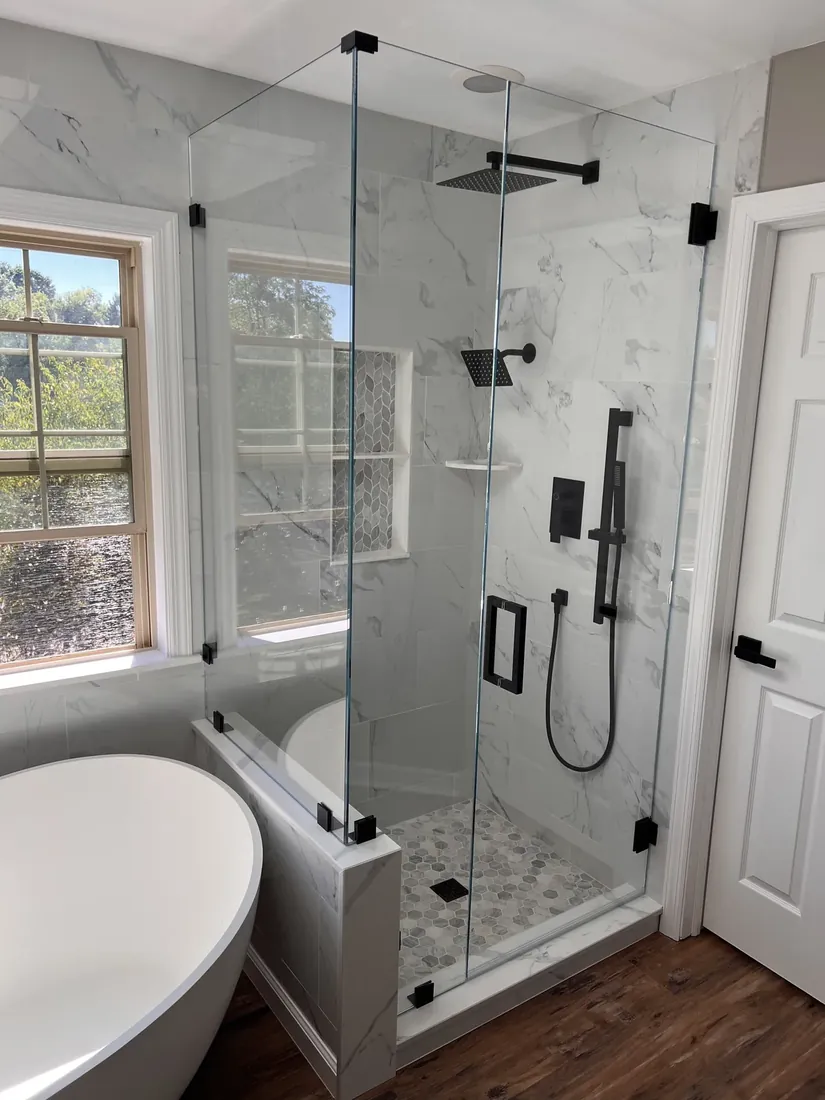 Glass walk-in shower and freestanding tub in a finished bathroom