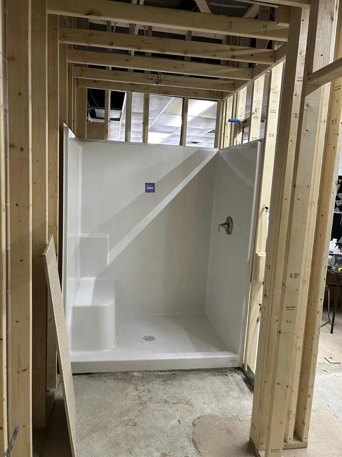 Shower being tiled during a bathroom remodel
