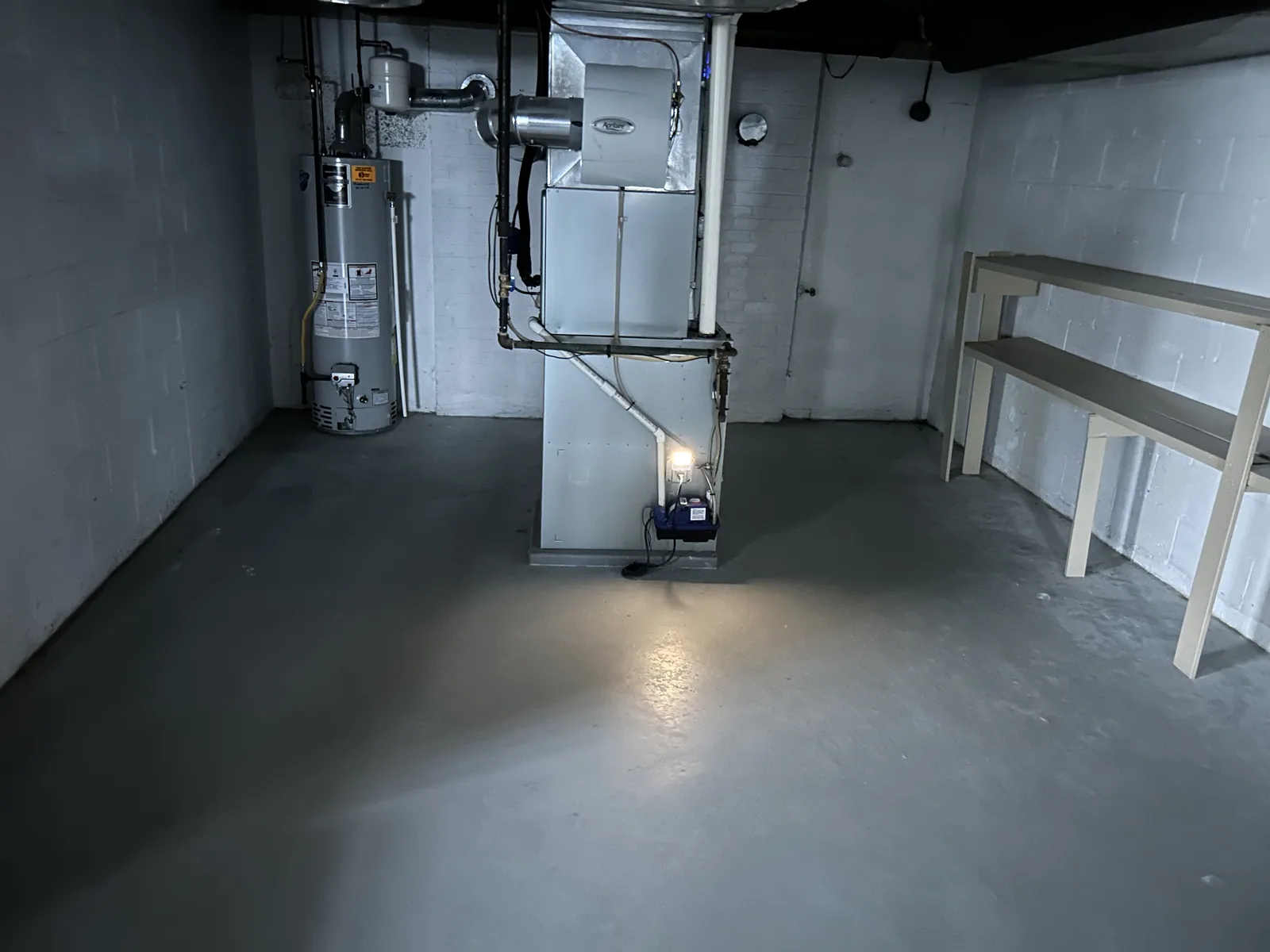 Sealed, coated basement floor
