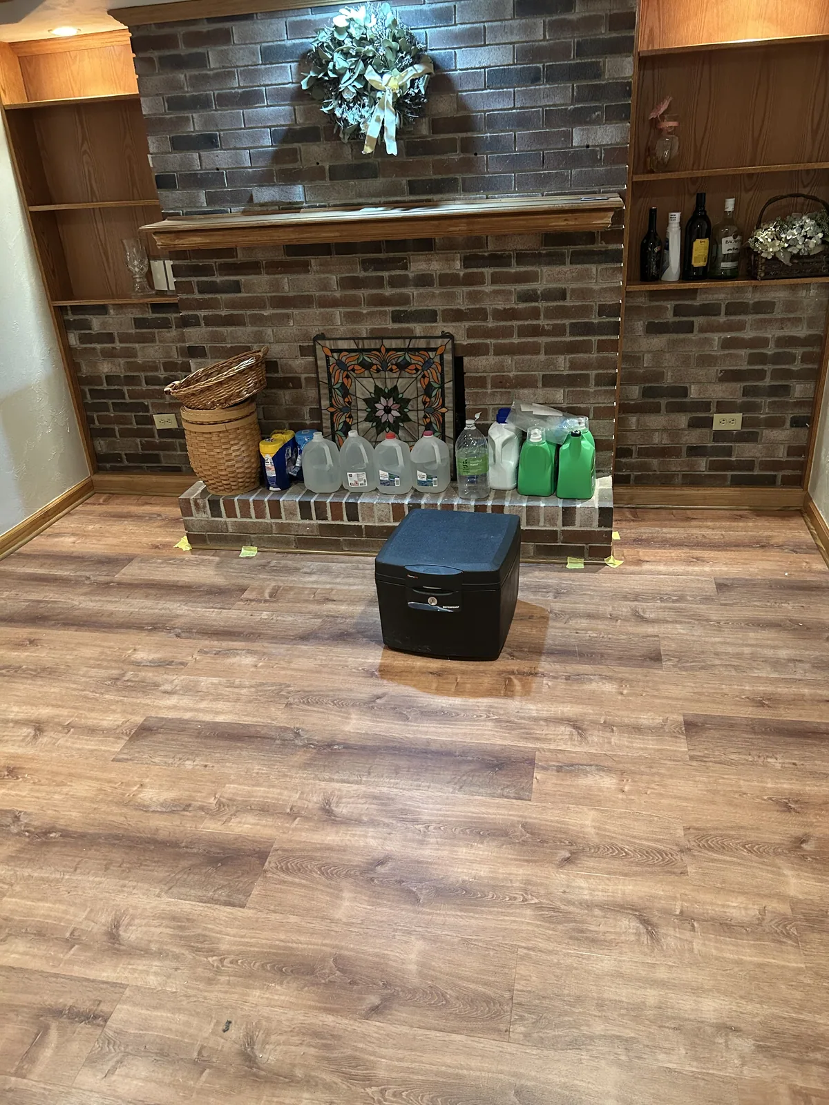 Finished interior with a wood accent wall and hardwood floor