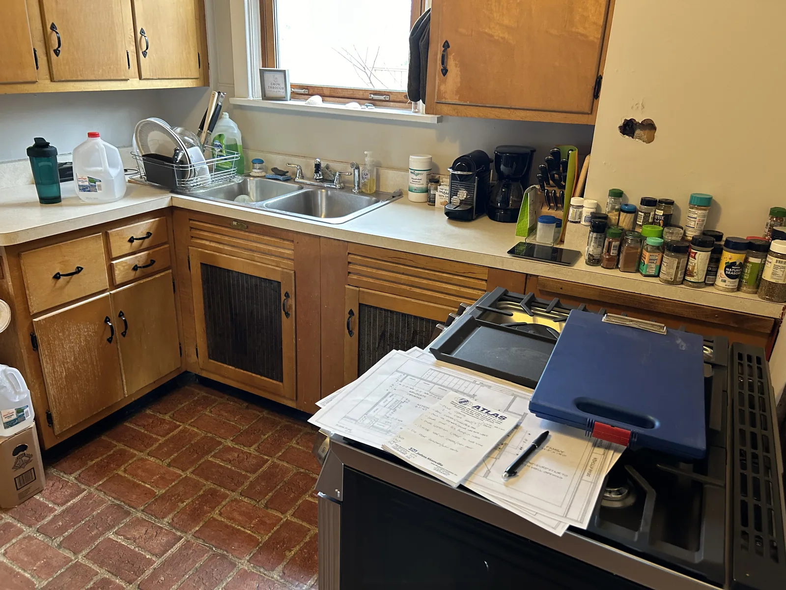 Dated kitchen with old cabinets before the remodel